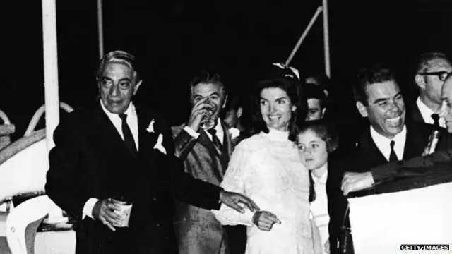 Jacqueline Kennedy Onassis with her daughter, Caroline Kennedy, and her new husband, Greek shipping magnate Aristotle Onassis after their wedding