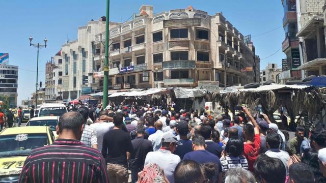 Suwayda 24 shows Syrians chanting anti-government slogans as they protest the country"s deteriorating economic conditions and corruption, in the southern city of Suwaida on June 9, 2020.