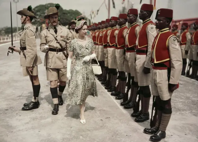 Queen Elizabeth II inspects troops at Kaduna Airport in Nigeria during her Commonwealth tour - February 1956
