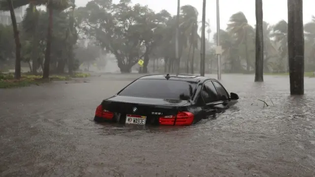 Car wey water don almost cover finish for Miami