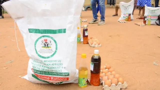 A crate of egg, a bottle of palm oil and a bag of rice