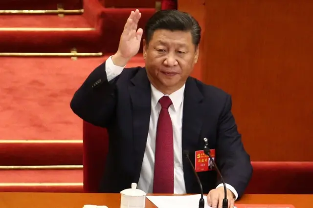 Chinese President and General Secretary of the Communist Party of China Xi Jinping raises hand to take a vote during the closing ceremony of the 19th National Congress of the Communist Party of China (CPC) at the Great Hall of the People (GHOP) in Beijing, China, 24 October 2017.