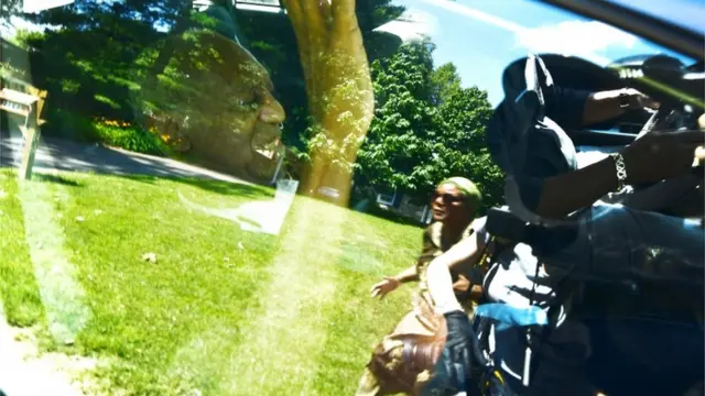 Bill Cosby sitting in a car