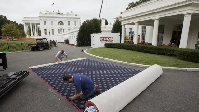 A carpet being cut outside the White House during the renovation work.
