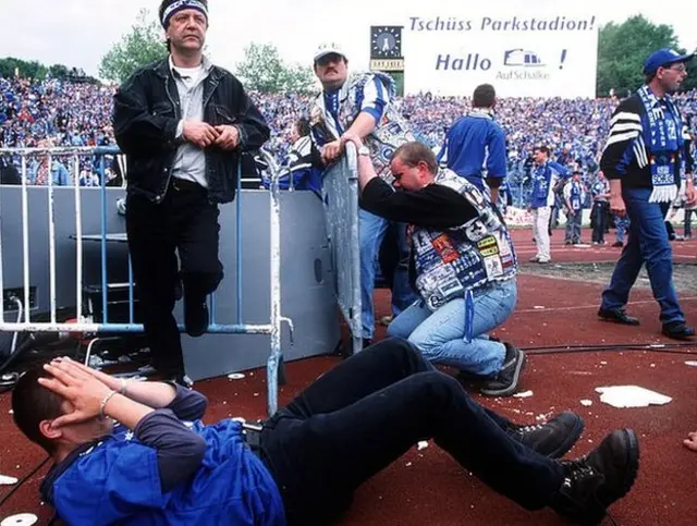 Schalke fans are disconsolate after realising Bayern have avoided defeat in Hamburg
