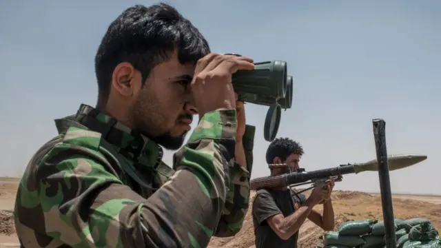 An Iraqi Popular Mobilisation Front Shi'ite militia on the Iraq-Syria border in Nineveh, Iraq.