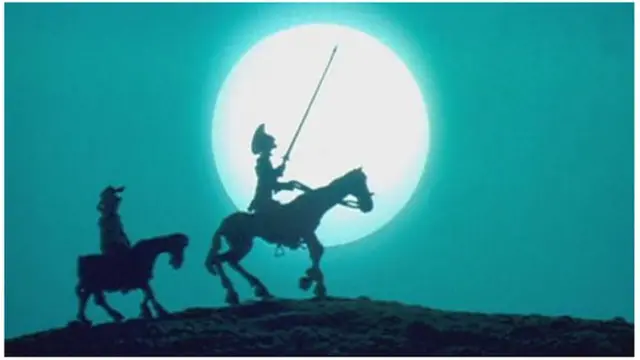 ডন কুইকসোট এবং সানচো পাঞ্জা ঘোড়ার পিঠে চাঁদের আলোতে ভ্রমণ করছেন।