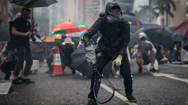 Protester hold tennis racket