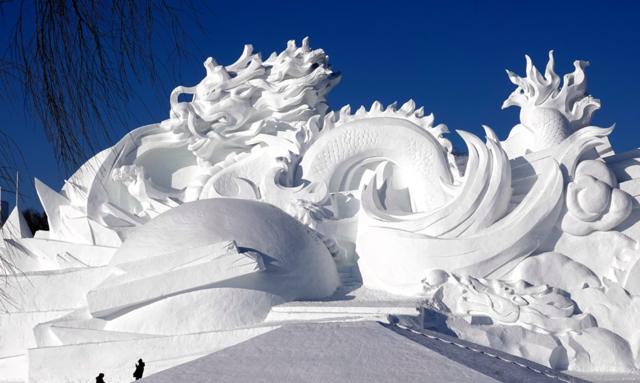 A large snow sculpture featuring Chinese dragons