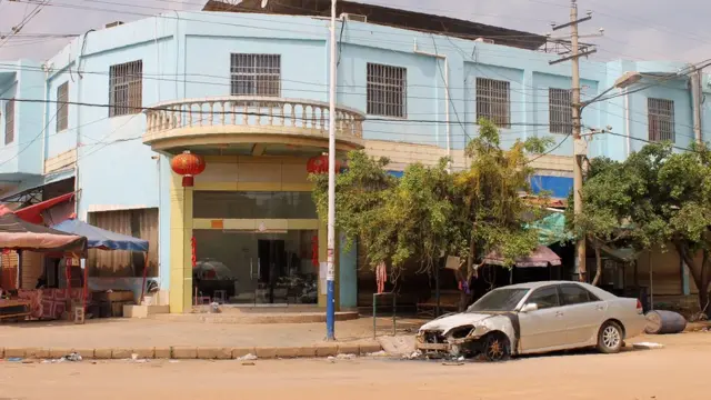This photo taken on March 10, 2017 shows the remains of a burnt car left on a street in Lauk kai, along the China-Myanmar border in the northern Shan State of Myanmar.