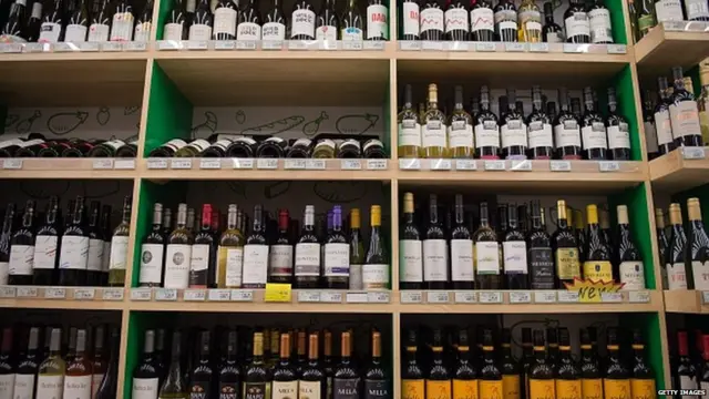 Stalls filled with wine products are seen in a supermarket