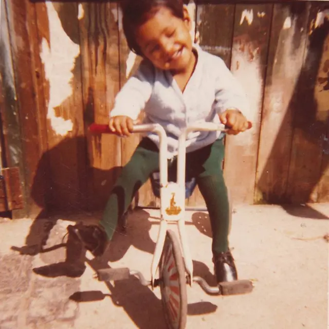 Kuli em uma bicicleta