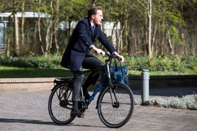 Mark rutte on a bike