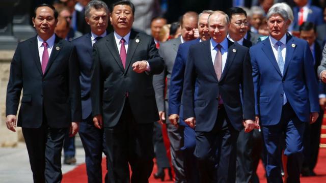 Chinese President Xi Jinping (centre L) and Russian President Vladimir Putin (centre R) arrive with other leaders for a family photo during the Belt and Road Forum, at the International Conference Center in Yanqi Lake, north of Beijing, on May 15, 2017.