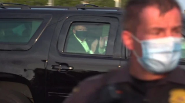 Trump waving at reporter outside hospital
