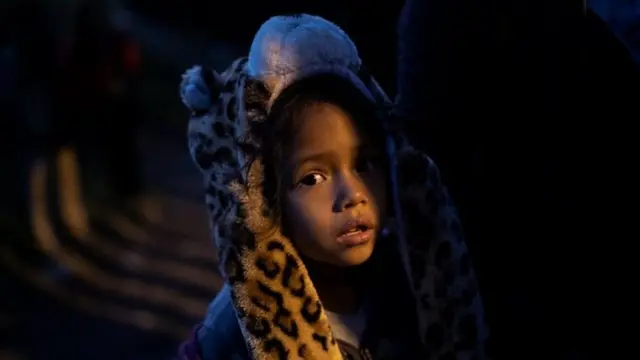 A migrant girl is seen before crossing from Mexico to the U.S with other migrants, in Tijuana, Mexico, December 3, 2018