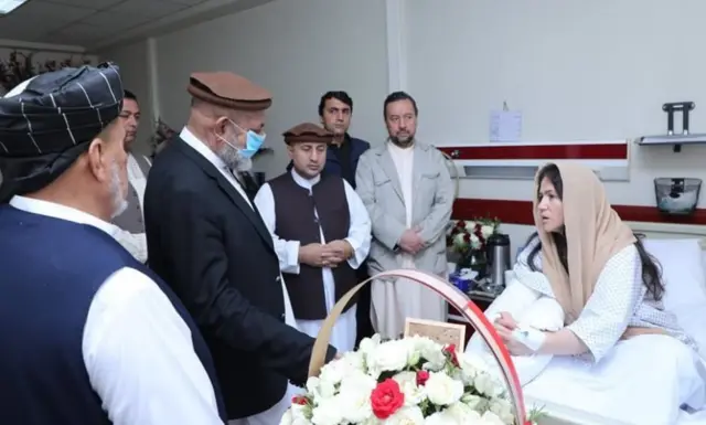 Fawzia Koofi being greeted by others