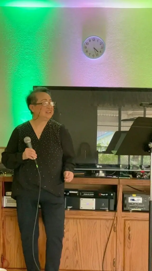 Tam singing with friends
