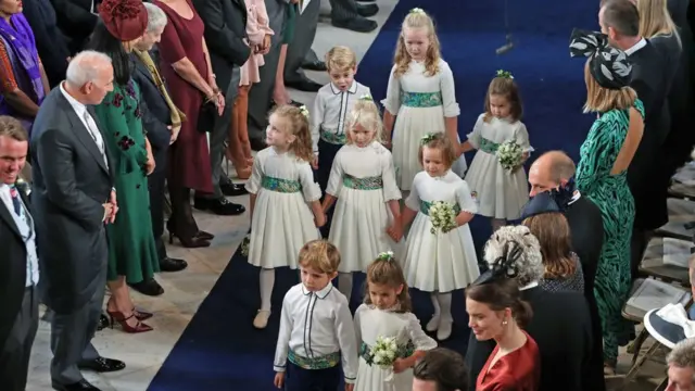 The bridesmaids and page boys, including Britain"s Prince George (back row L) and his sister Princess Charlotte