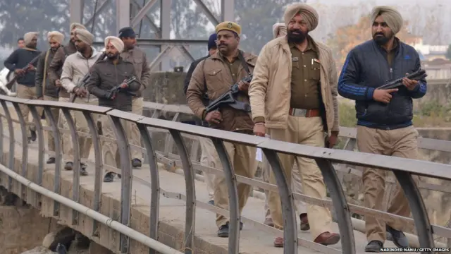 Indian police personnel patrol near the air force in Pathankot on January 4, 2016.
