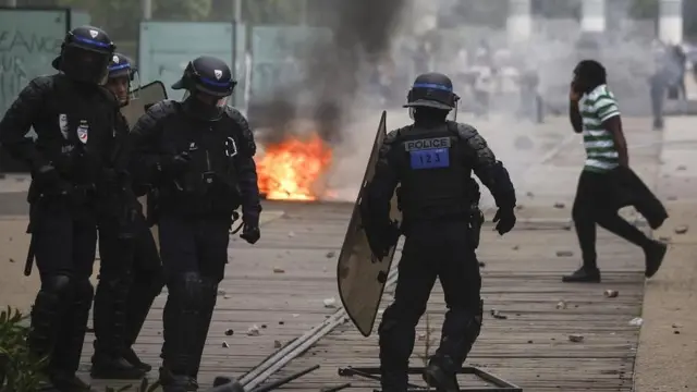 French riot police take position during clashes with protesters following a march in the memory of 17-year-old Nahel, who was killed by French Police in Nanterre, near Paris, France, 29 June 2023
