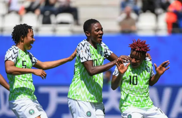 Nigeria's players celebrate after South Korea scored an own goal during the France 2019 Women's World Cup Group A football match between Nigeria and South Korea, on June 12, 2019, at the Alpes Stadium in Grenoble, central-eastern France. (Photo by Jean-Pierre Clatot / AFP) (Photo credit should read JEAN-PIERRE CLATOT/AFP/Getty Images)