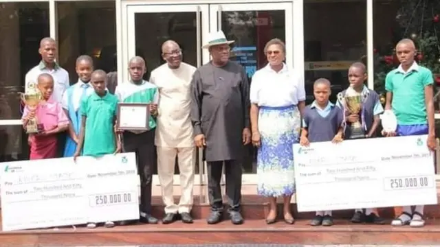 Govnor Wike and di none children wit dia awards wey dem bin win for di competition.