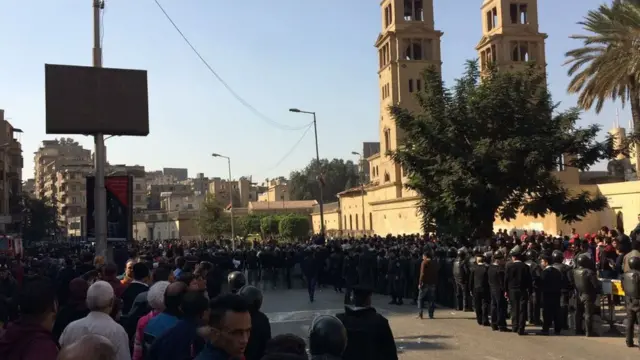 Protesters gathered outside the church