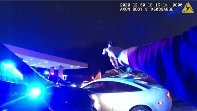 Police officer points gun in fatal shooting