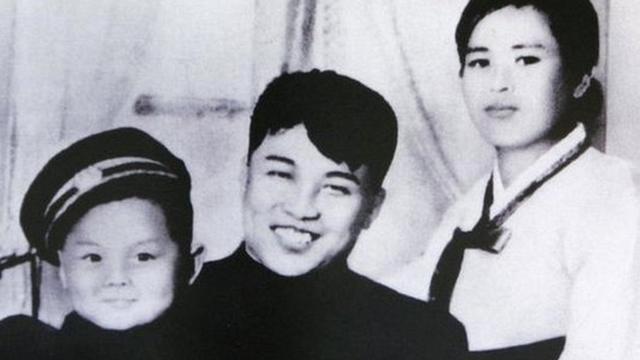 An undated North Korean propaganda picture, claiming to be North Korean founder Kim Il-sung (C), his first wife Kim Jong-suk and his son Kim Jong-il, displayed at a high school in Seoul.