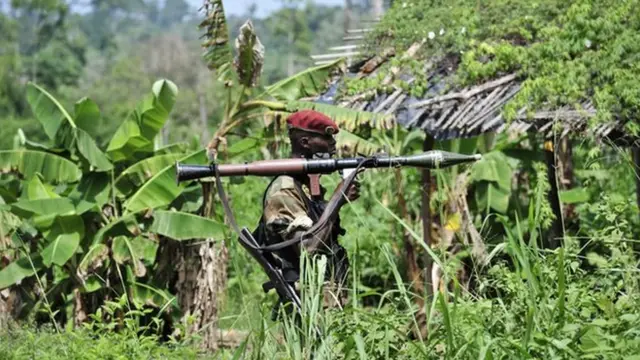 Soldier wey dey inside of forest.