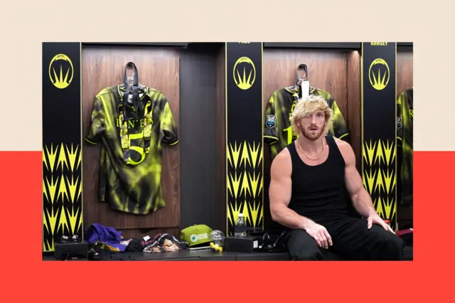 Logan Paul, a muscular man with peroxide blonde hair, wearing a black vest while sitting in a locker room