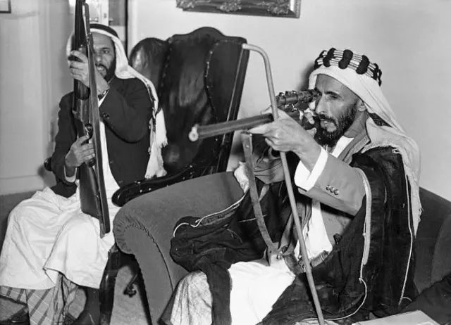 Abu Dhabi ruler Sheikh Shakhbut bin Sultan Al Nahyan aiming a rifle, part of the Rettershof gun collection at the Konigstein, Main-Taunus, Hesse, Germany, 8th July 1961.