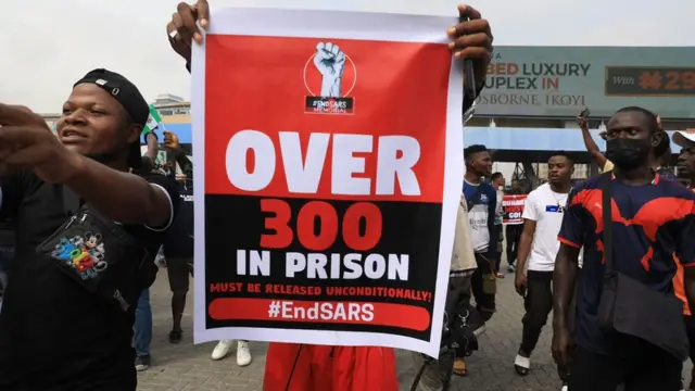 End Sars protesters carry placards