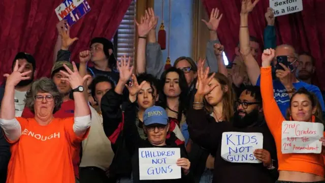 Supporters in the gallery silently cheer as Rep. Justin Pearson speaks on the day it is scheduled to vote to expel three Democratic members for their roles in a gun control demonstration at the statehouse last week, in Nashville, Tennessee, U.S., April 6, 2023.