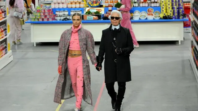 Fashion Designer Karl Lagerfeld and model Cara Delevingne appear for di end of di runway during di Chanel show as part of di Paris Fashion Week Womenswear Fall/Winter 2014-2015 on March 4, 2014 inside Paris, France.