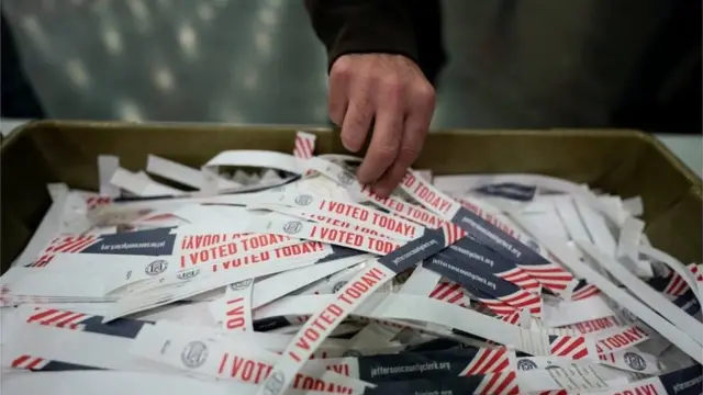 A voter takes a "I voted today" badge at the Kentucky Exposition Center during the election in Louisville, Kentucky, U.S. November 3, 2020