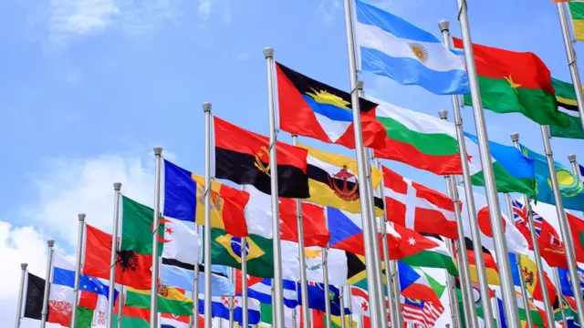 Flags from all over the world, flying on masts.