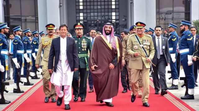 Pakistan"s Prime Minister House (PMH) on February 18, 2019, Pakistan"s Prime Minister Imran Khan (2L) and Pakistani Army Chief General Qamar Javed Bajwa (R) walk along with Saudi Arabian Crown Prince Mohammed bin Salman