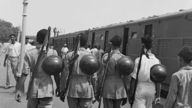Muslim League National Guards on a platform at a railway station in New Delhi, India, August 1947. They are helping with the departure of six hundred Muslim residents of Delhi to Karachi, Pakistan on a special train