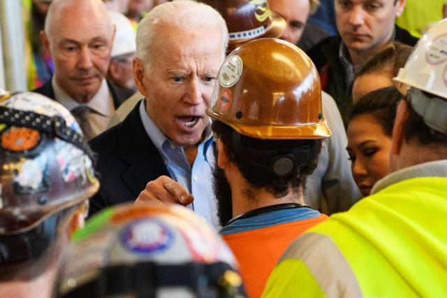 Democratic presidential candidate Joe Biden has a heated exchange with a worker as he tours the Fiat Chrysler plant in Detroit, Michigan on 10 March 2020