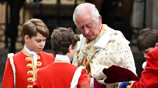 King Charles arrives in the Diamond Jubilee State Coach from Buckingham Palace to Westminster Abbey to his coronation ceremony