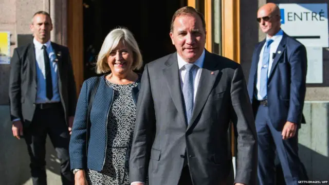 Swedish Prime Minister and leader of the Social Democratic party, Stefan Lofven and his wife Ulla Lofven leave the polling station after voting in the Swedish general elections on September 9, 2018 in Stockholm.