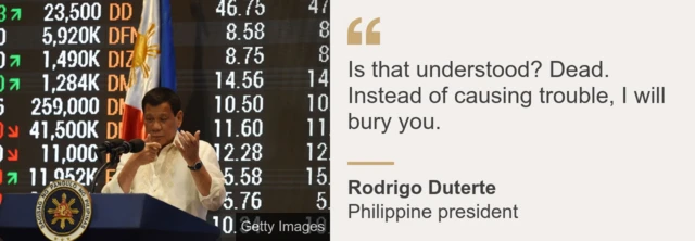 President Rodrigo Duterte mimicking firing a rifle