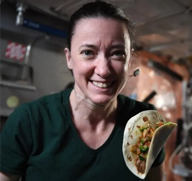 Megan McArthur with a taco on board the International Space Station (ISS) in November 2021