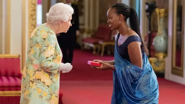 Priscilla akitunukiwa tuzo la Queens Young Leaders kutoka kwa Malkia Elizabeth wa Uingereza kwa ajili ya vijana kwa mchango wake wa kutoa ajira kwa wanawake wasiojiweza. mwaka jana