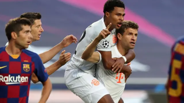 Thomas Muller (centre) celebrates scoring for Bayern Munich against Barcelona