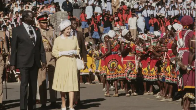 Queen Elizabeth alongside President of Kenya Daniel arap Moi (1924-2020) as she greet well wishers on her arrival for Nairobi, Kenya, 10th November 1983
