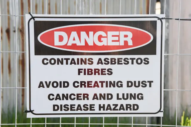 A sign warning of the dangers of asbestos