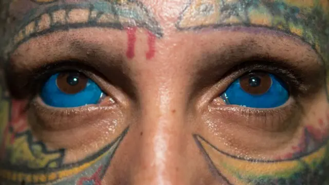 Man with eye tattoo
